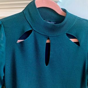 Dark green size small 3 hole cut out on front sleeves are sheer and see through